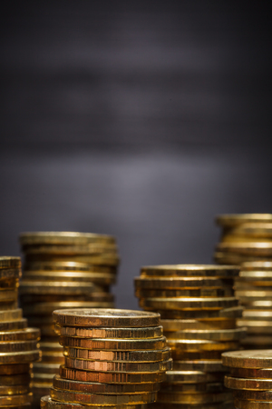 Gold coins - gold reserves. Small amount of money for a rainy day. The crisis of the economy.の写真素材