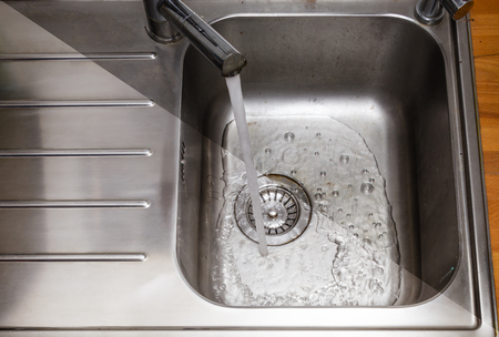 Daily cleaning of the kitchen - washing sinksの写真素材