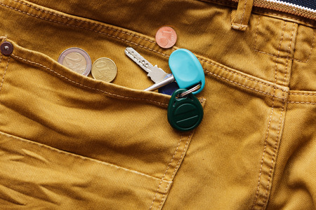 keys and coins in the back pocket of jeans.の写真素材