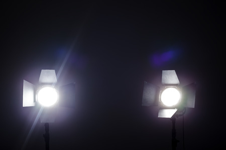 Lighting equipment on a black background old shabby wallの写真素材