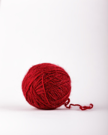 Tangle of red wool for knitting. Best Natural toys for cats.の写真素材