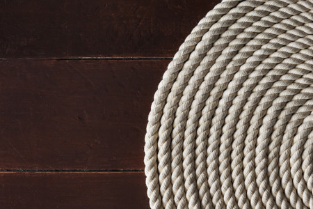 White rope on a wooden deckの写真素材