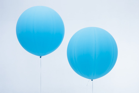 Two blue inflated balloonsの写真素材