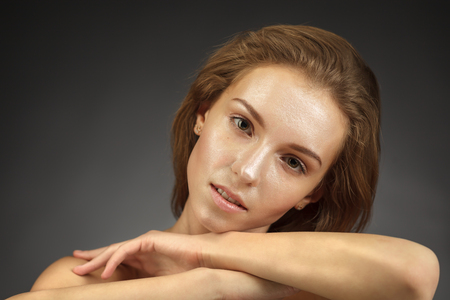 Beautiful girl with shiny skin. Facial and cosmetic treatmentsの写真素材