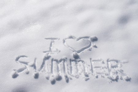The inscription on the snow "I love summer". The dream of a warm holidayの写真素材