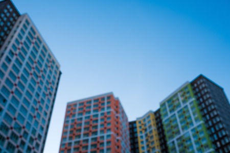 Abstract blurred buildings from below by looking up.の写真素材