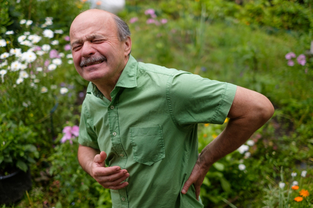 Old man having lumbago painの写真素材