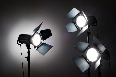 Several reflectors on the black background in photo studio. ready to do professional shootingの写真素材