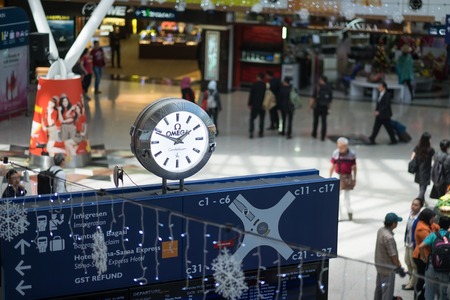 Kuala Lumpur, Malaysia - December 06, 2017: Inside of Kuala Lumpur International Airports terminal with many people and time scoreboardのeditorial素材