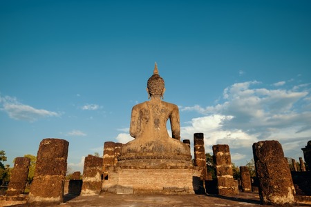 Sukhotha, Thailand - November 20, 2017: Wat Mahathat Temple in Sukhothai Historical Park, a UNESCO World Heritage Site in Thailand. Buddha statue from backsideのeditorial素材