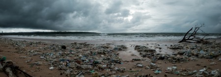 Bali, Indonesia - December 19, 2017: Garbage on beach, environmental pollution in Bali Indonesia. Storm is coming on background. And drops of water are on camera lens. Dramatic viewのeditorial素材