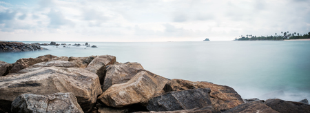 Landscape view on rocky coast ocean in Midigama Srilanka. View on surf spotの写真素材
