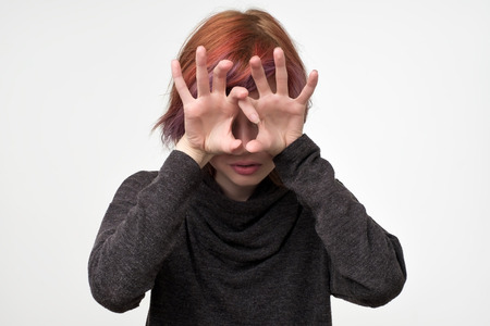 Angry woman holding fingers like she is going to attack. Negative emotion concept. Misunderstanding...