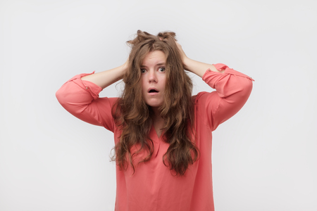 Human emotions, feelings, reaction and attitude. Terrified young plump woman is confused, feeling danger, she is surprised with sales prices. Getting news about exam or other important life affairの写真素材