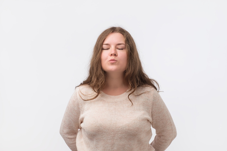 A young european emotional girl giving an air kiss to her friend. Saint valentine day conceptの写真素材