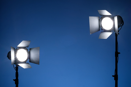 Equipment for photo studios and fashion photography. Blue background and reflector. Ready to shoot photo scheme concept.の写真素材