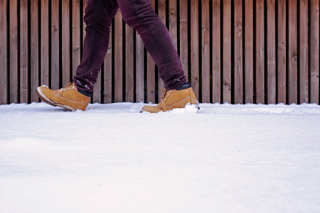 View of shoes or boots footprint in fresh snow. Winter season.の写真素材