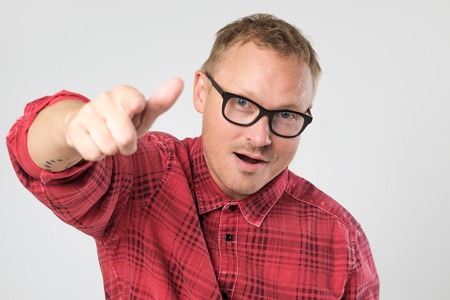 Handsome mature man pointing to the frontの写真素材