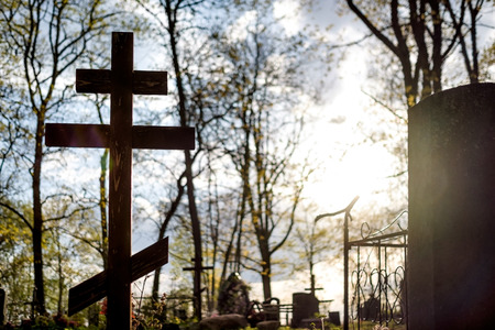 Grave cross on the Orthodox Christian cemetery at sunny day in Russiaの写真素材