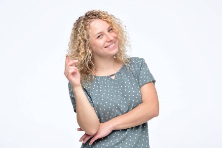 Beautiful cheerful curly girl smiling laughing looking at camera