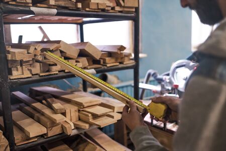 Selecting a board testing its quality for wood work.の写真素材