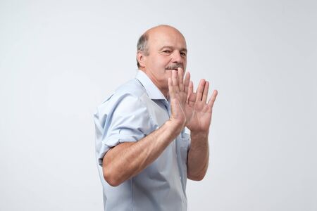 man showing refusal gesture. It is not for me, leave me in piece