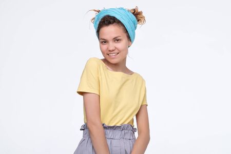 Young pretty woman with dreadlocks smiling confident looking happy in yellow t-shirt isolated on...