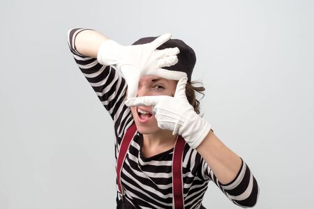 Mime woman making frame with her handsの写真素材