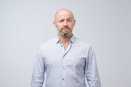 Doubt, mistrust, distrust concept. Mature man looking with disbelief expressionの写真素材