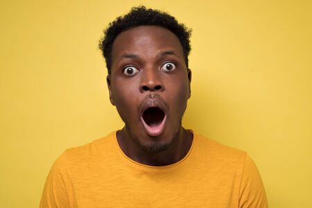 Young african american black man surprised face expressionの写真素材