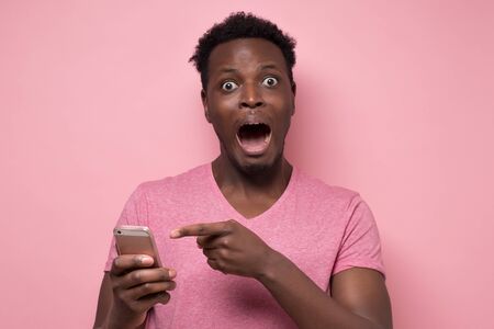 African american man feeling stressed receiving bad news. Somebody has stolen his password. Phishing concept.の写真素材