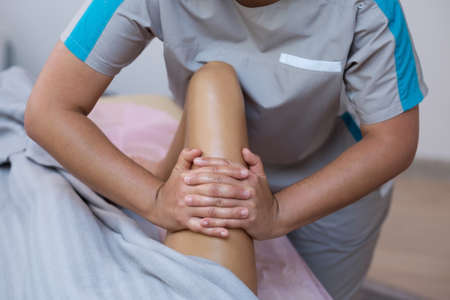 Woman receiving a leg massage on spa therapy