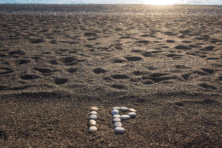 IP Intellectual Property or Internet protocol text made from stones on sea beachの写真素材