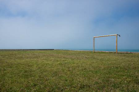 soccer field in the countryside. view on the sea. Playing football at the seashore.の写真素材