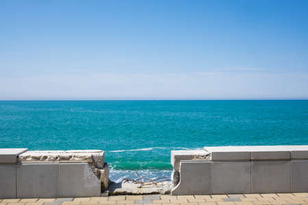 A rocky beach on the Black Sea in Kobuleti, Georgia. Ruined old parapetの写真素材