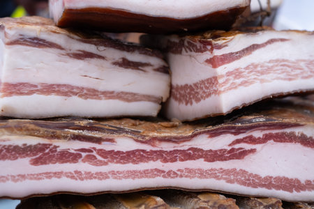 Pieces of salty high-fat meat in a shop. Salo or bacon. tasty meat.の写真素材