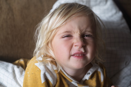 European 4 Year Old Blonde Girl Sick with Cold Resting at Home
