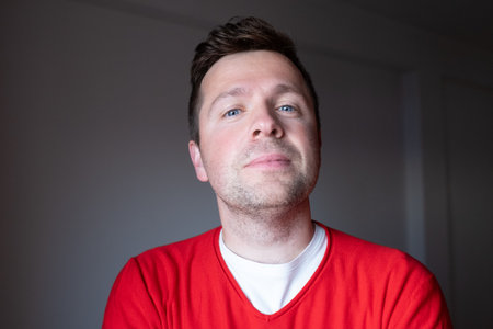Portrait of a Middle Aged European Man in a Red Sweater, Emotional Photography