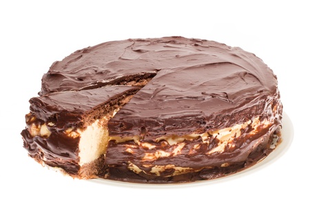 Cake with a piece cut out on a white backgroundの写真素材