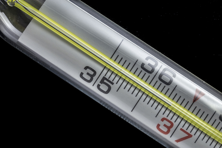 Macro of a mercury thermometer with a scale which shows normal temperatureの写真素材