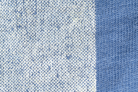 old worn inscription on the t-shirt tissue macroの写真素材