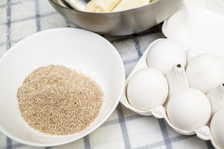 On the table are wheat bran, eggs, bananas ready for cooking dietetic dessert, close-upの写真素材