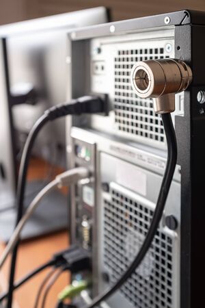 Security lock is installed on the computer to prevent theft and ensure the safety of hardware.の写真素材