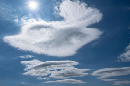 Beautiful, soft clouds against the blue sky, on a summer sunny day.の写真素材