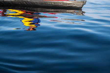 Surface of the lake and the kayak, which is reflected on the surface, on a summer day. Active lifestyle.の写真素材