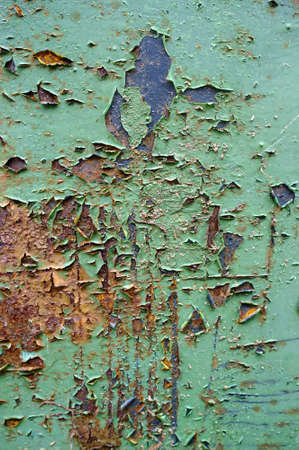 Abstract background. Old, rusty sheet of metal with peeling paint. Copy space.の写真素材