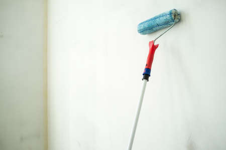Wall is ready to be painted with a sponge roller. Home renovation. Copy space.の写真素材