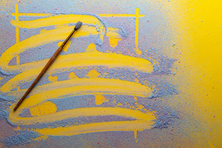 Strikethrough postcard with hearts made of blue powder on a yellow background, next to it is a...