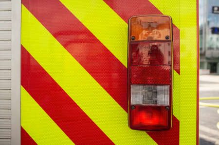 Close-up fire truck, with red lights for safe driving, outdoors.の写真素材
