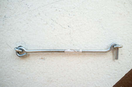 New metal hook on a white wall.の写真素材